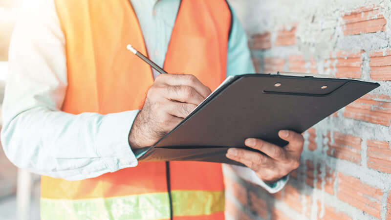 A Contractor Assessing Site Conditions Jpg