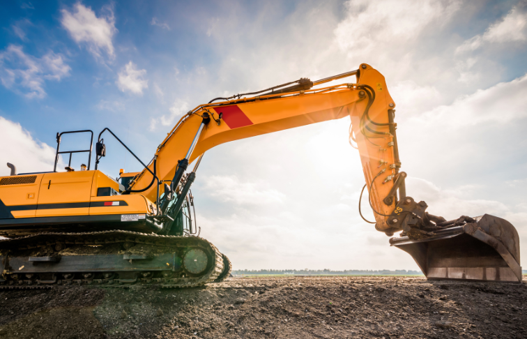 Yellow excavator digging on a construction site