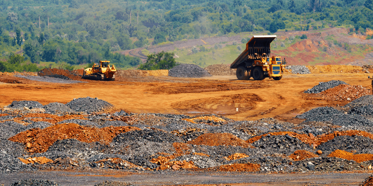 A dump truck offloading excavated soil