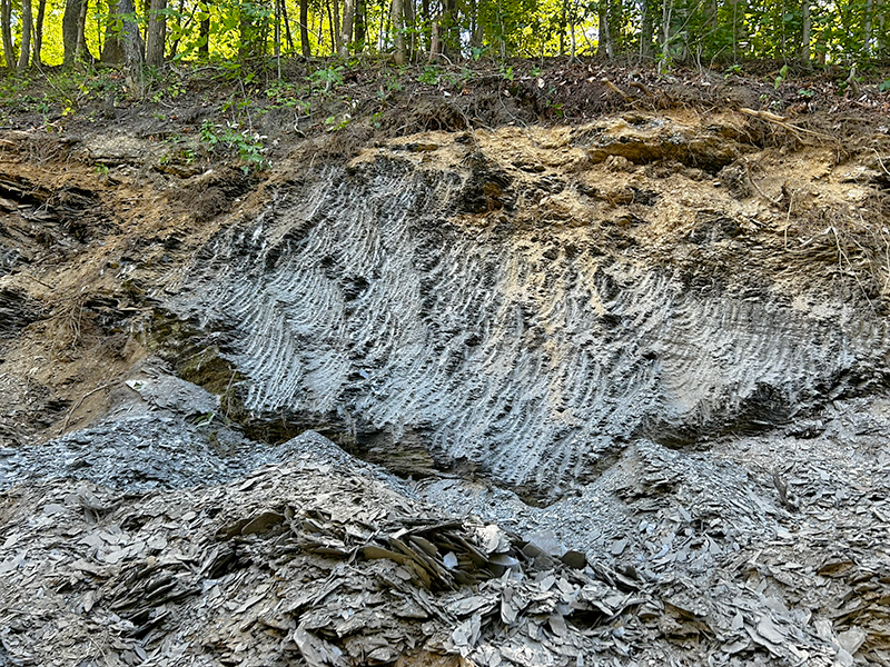 Shale bedrock cleanly cut to increase roadway width
